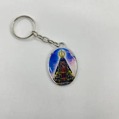 Chaveiro Oval Dupla Face Aparecida e São Jorge