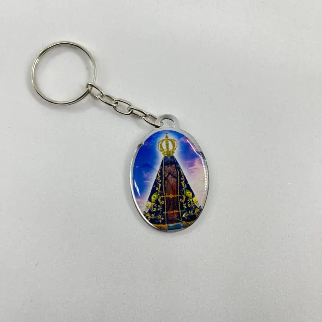 Chaveiro Oval Dupla Face Aparecida e São Jorge