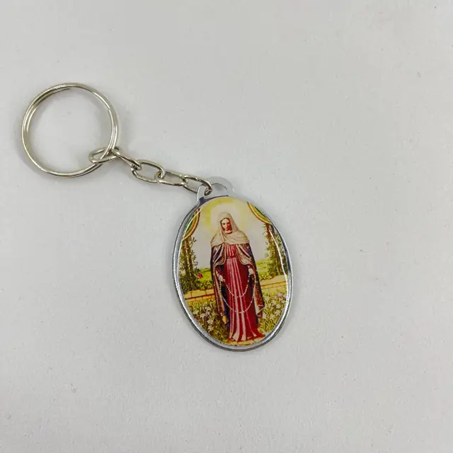 Chaveiro Oval Dupla Face Nossa Senhora das Lágrimas e Jesus Manietado